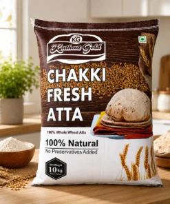 A 10 kg bag of Kathait Gold Chakki Fresh Atta displayed on a wooden kitchen countertop next to a bowl of stone-ground wheat flour, fresh rotis, and golden wheat grains.