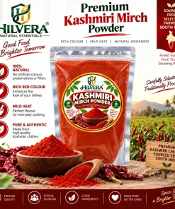 Hilvera Premium Kashmiri Mirch Powder transparent pouch with whole red chillies and ground chilli bowl sourced from South India