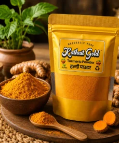 Kathait Gold turmeric powder in premium gold packaging with turmeric roots and ground turmeric powder